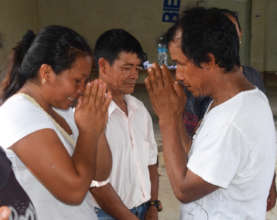 Gisela and Antonio practice "Namaste" closing