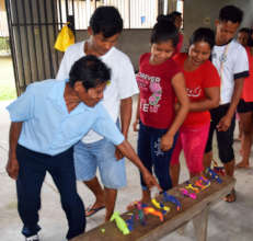 Artisans inspecting first round of paper toucans