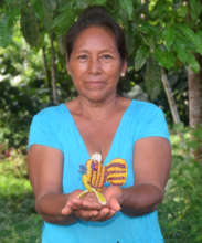 Artisan Liria with woven fish ornament