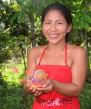 Artisan with woven chambira snail