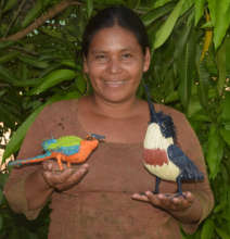 Maranon artisan with woven motmot and kingfisher