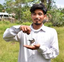 Maijuna artisan with ornate hawk eagle ornament
