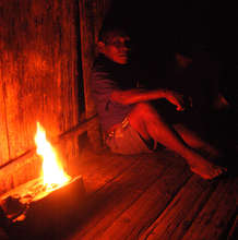 Maijuna shaman sleeping by copal resin flame