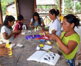 Artisans making paper toucans at workshop in Nauta