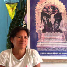 Mariela with COVID free banner
