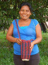 Artisan with woven chambira water bottle carrier