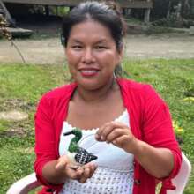 Huitoto native artisan and common loon ornament