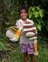 Bora artisan daughter with bottle carriers