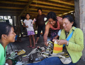 CACE project manager inspecting bottle carriers