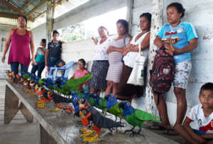 Artisans at Nuevo Peru workshop with birds