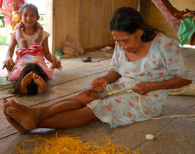 Angelina's mother Ernestina weaving a belt