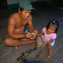 Bora artisan carving tutuma ornament with daughter
