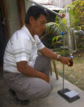 Shebaco collecting copal oil from distilled resin