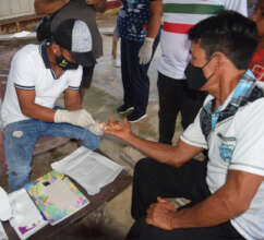 Learning to take blood samples to test for malaria