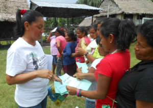 Yully with artisans at workshop