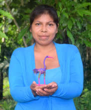 Artisan from San Francisco with woven purple egret