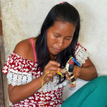 Artisan making ornate hawk eagle ornament