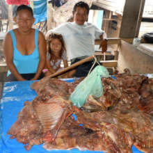 Game meat vendors at public market in Pebas