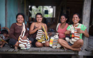 Bora native artisans with woven bottle holders