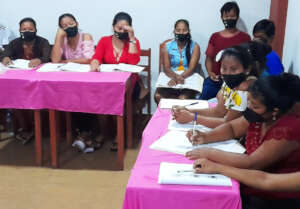 Artisans practice writing stories at workshop