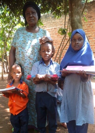 Children picking up school supplies