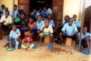 Children eating posho and beans