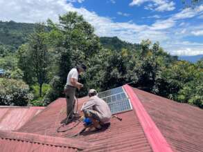 Installing panels on the roof (of the world!)