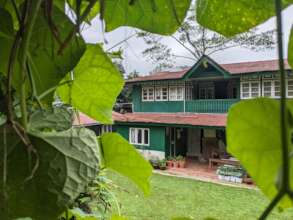 Main house with solar panels top left