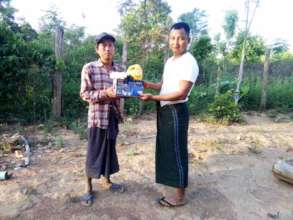 The headman(right), hands over the lantern