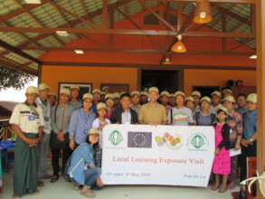 Solar Roots Training Center with visiting group