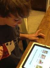 Max loves using his iPad to learn!