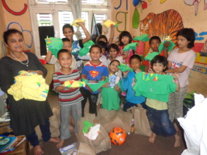The kids receiving clothes from our committee.