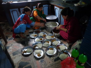 CDC Nepal committee members serving  food.