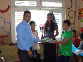 CDC Nepal treasure distributing goods to the kids