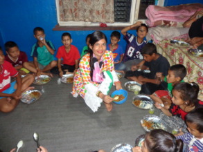CDC committee  member  serving food to them kids