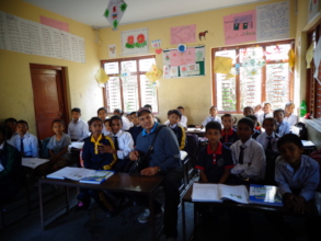 Chairman posing with students