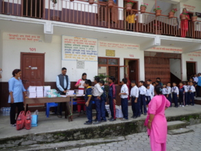 Students are being happy to get stationery.