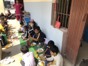 Providing food to orphanage kids