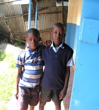Boys delivering water to the kitchen