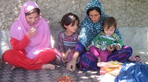 Family sampling strawberry harvest