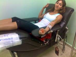 Volunteer donating blood for a patient
