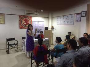 Dr. Vishakha explaining correct method of brushing