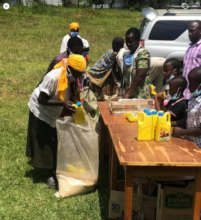 Our children helping with food distribution