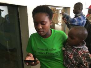 High school student helping with the young ones