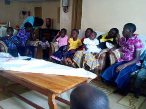 high school girls helping with the young ones