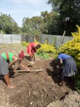 Our high school students helping at the school