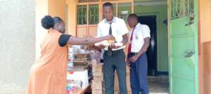 Students receiving their back to school hampers
