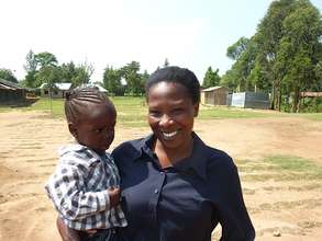 Rose Bugusu, Director of TMSC with child