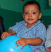 Allan playing w/ a balloon at the clubfoot clinic
