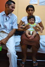 A family waits for treatment to begin